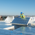 Platen van Unilin op het dak